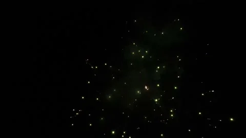 Fireworks exploding in the night sky near a drone camera. Stock Footage 201426795