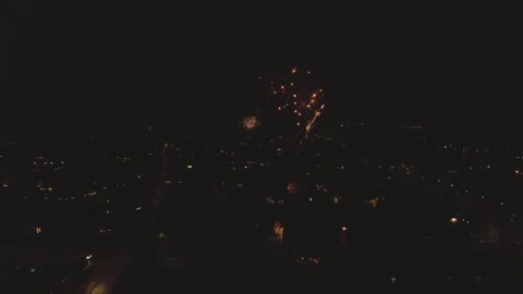 Fireworks Exploding In Night Sky Over Downtown City During Holidays. Stock Footage 263611554