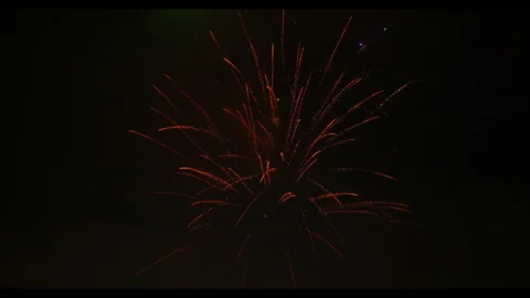 Fireworks exploding in night sky with smoke and clouds, no people Video stock 329773844