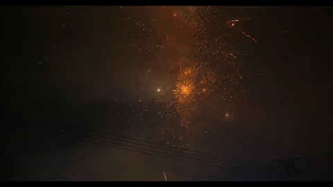 Fireworks exploding in night sky with smoke and clouds, no people Stock Footage 329773949