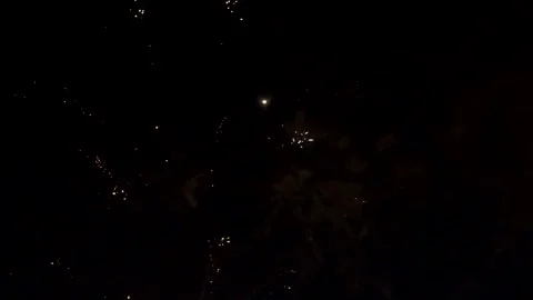 Fireworks exploding in the night while camera moves a bit. Close up. Stock Footage 156223530