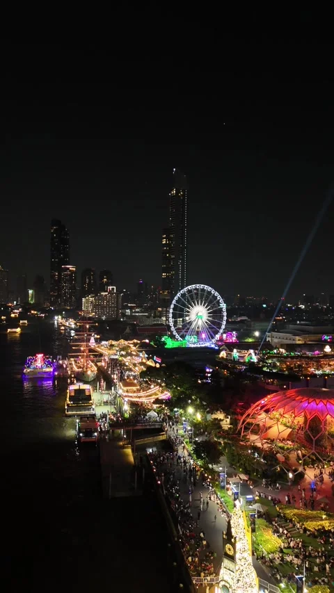 Fireworks Exploding Over Bangkok's Asiatique Ferris Wheel at Night in Bangkok, Stock Footage 335973515