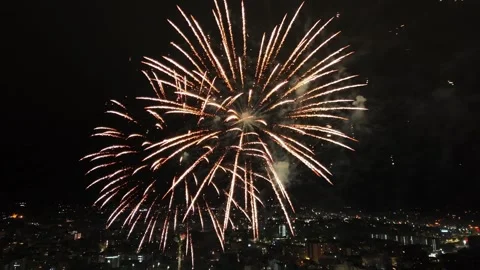 Fireworks exploding over city at night Video stock 328481904