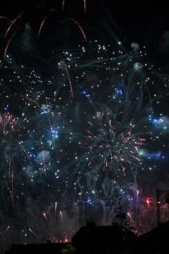 Fireworks Exploding Over City at Night Foto stock