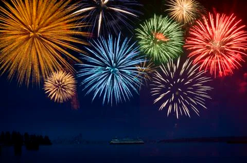 Fireworks exploding over cruise ship in bay, Seattle, Washington, United States Stock Photos