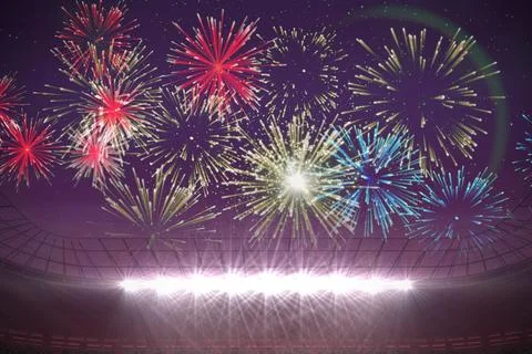 Fireworks exploding over football stadium Stock Photos