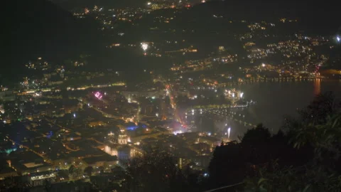 Fireworks exploding over night city New Years Eve close up Stock Footage 336201008