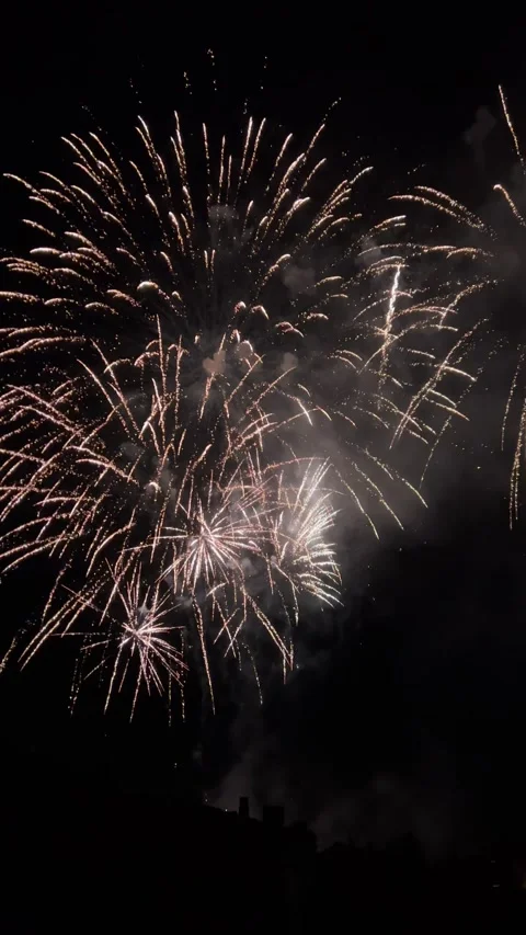 Fireworks exploding over Olot, Spain at night Stockbeeldmateriaal 345048226