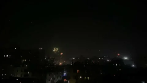 Fireworks Exploding Over Silhouette Of Buildings In Dhaka. Time Lapse - Stock Footage 169143776