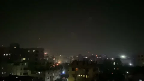 Fireworks Exploding Over Silhouette Of Buildings In Dhaka. Locked Off Stock Footage 169149204
