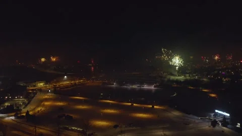 Fireworks Exploding Over Sports Field At Night In Reykjavik, Iceland. aerial Stock Footage 306275884