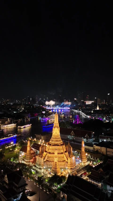 Fireworks Exploding Over Wat Arun Temple in Bangkok, Thailand at Night Stock Footage 335838915