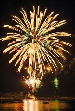 Fireworks exploding over water, Bainbridge Island, Washington, USA 스톡 사진
