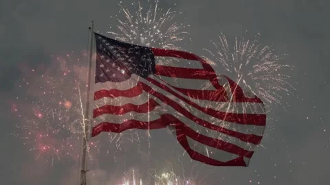 Fireworks Exploding Over Waving American Flag in Evening Sky Video stock 336900735