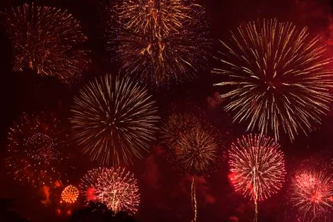 Fireworks exploding in red sky Stock Photos