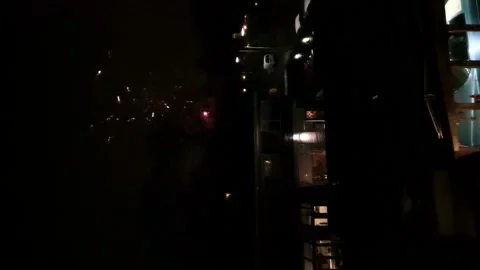 Fireworks Exploding In Sky Beside Building At Night Stock Footage 168739672