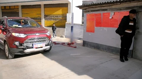 Fireworks exploding with sparks celebrating Chinese wedding as ford car Stock Footage 122919118