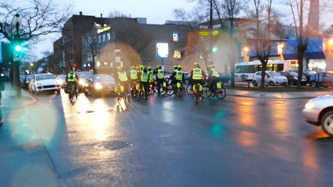Fireworks exploding in the street in front of police on bicycle Stock Footage 114763555