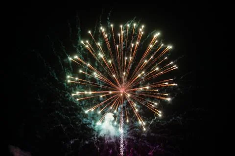 Fireworks explosion at night sky background. Holiday bright salute Stock-Fotos