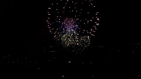 Fireworks Explosion on sky from drone black Motion Background loop Sky on Video stock 153908379