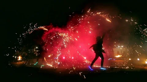 Fireworks. Fire show with dancing girl and man. Amazing at night Stock Footage