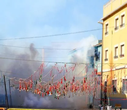 Fireworks firecrackers exploding in smoke street Stock Photos