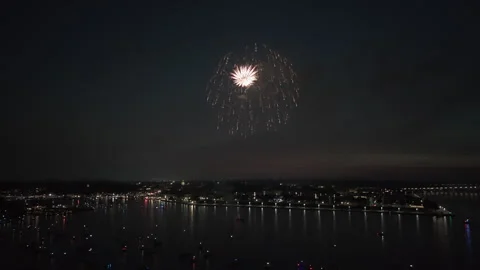 Fireworks Glowing Against The Dark Sky Over Ocean City, Maryland, USA - Wide Video stock 333962072