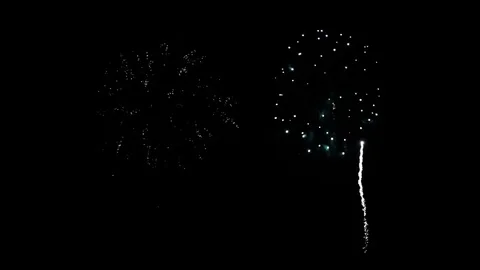 Fireworks go off over the ocean Stock Footage 80804825