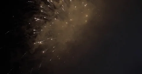 Fireworks going off over black night sky Stock Footage 78888134