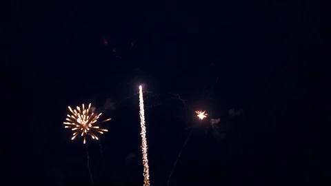 Fireworks Going Off In Quick Succession Lighting Up the Night Sky Stock Footage 92510037