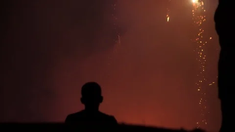 FIREWORKS KID HEAD NIGHT Stock Footage 92911065