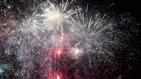 Fireworks light up the dark sky with dazzling display. Stock Footage 94266749