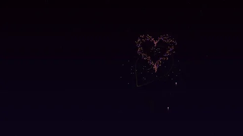 Fireworks light up the night sky on Valentines Day with heart shapes explod.. Stock Footage 326514394