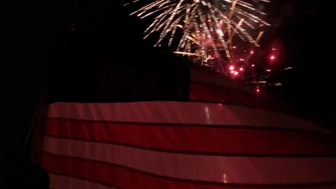 Fireworks lighting up flag Stock Footage 157239714