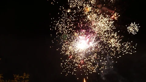 Fireworks lighting up the night sky Stock Footage 96983209