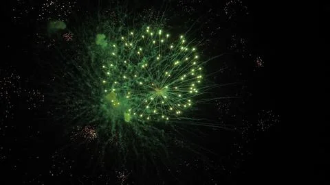 Fireworks magic creates shimmering trace ornaments in black night sky Foto stock