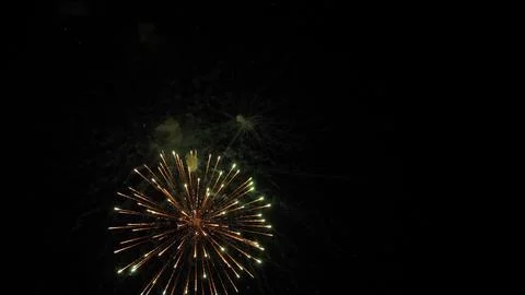 Fireworks magic creates shimmering trace ornaments in black night sky Foto stock