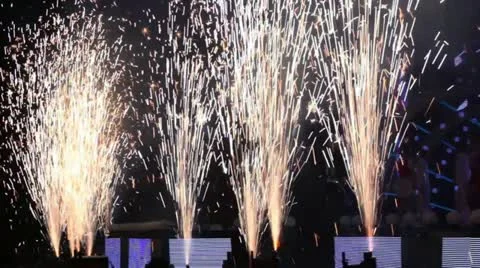 Fireworks near stage during concert show in dark hall Stock Footage