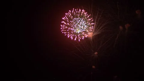 Fireworks in the night sky close up. festive abstract background Stock Footage 137744861