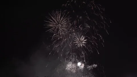 Fireworks at night sky. New year celebration. Shining fireworks with bokeh light Stock Footage 125904151