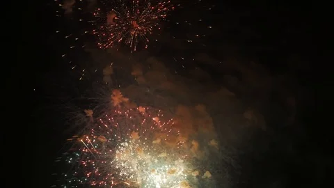 Fireworks or salut. Multi Colored explosions and smoke in night sky. Symbol of Stock Footage 107747895