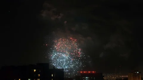 Fireworks or salut. Multi Colored explosions and smoke in night sky. Symbol of Stock Footage 107873504