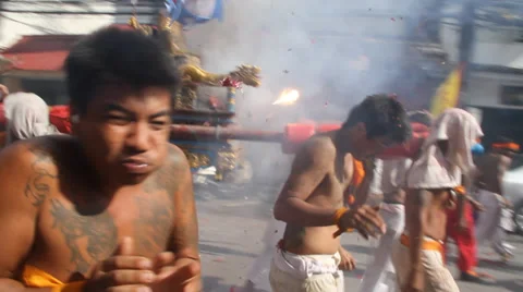 Fireworks over devotees at Phuket Vegetarian Festival Stock-Footage 31750200