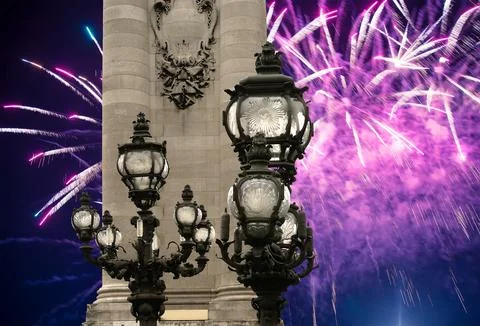 Fireworks over the Lamp posts on Alexander III Bridge. Paris, France Stock Photos