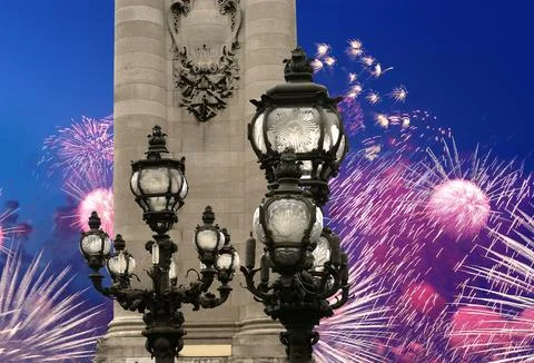 Fireworks over the Lamp posts on Alexander III Bridge. Paris, France Stock Photos