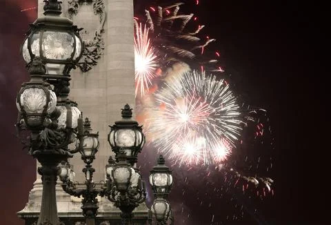 Fireworks over the Lamp posts on Alexander III Bridge. Paris, France Stock Photos
