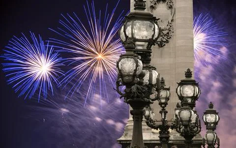 Fireworks over the Lamp posts on Alexander III Bridge. Paris, France Stock Photos