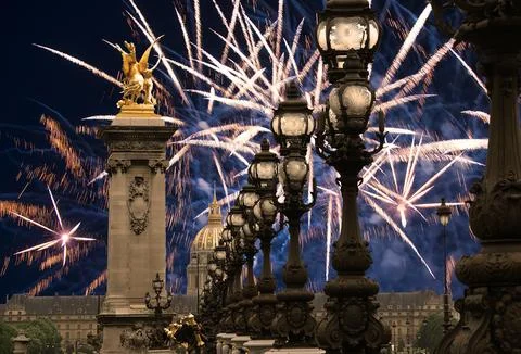 Fireworks over the Lamp posts on Alexander III Bridge. Paris, France Stock Photos