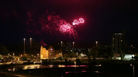 Fireworks over town centre and reflection in lake Stock Footage 36779962