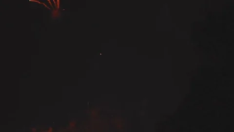 Fireworks pop with Bokeh Stock Footage 77210386
